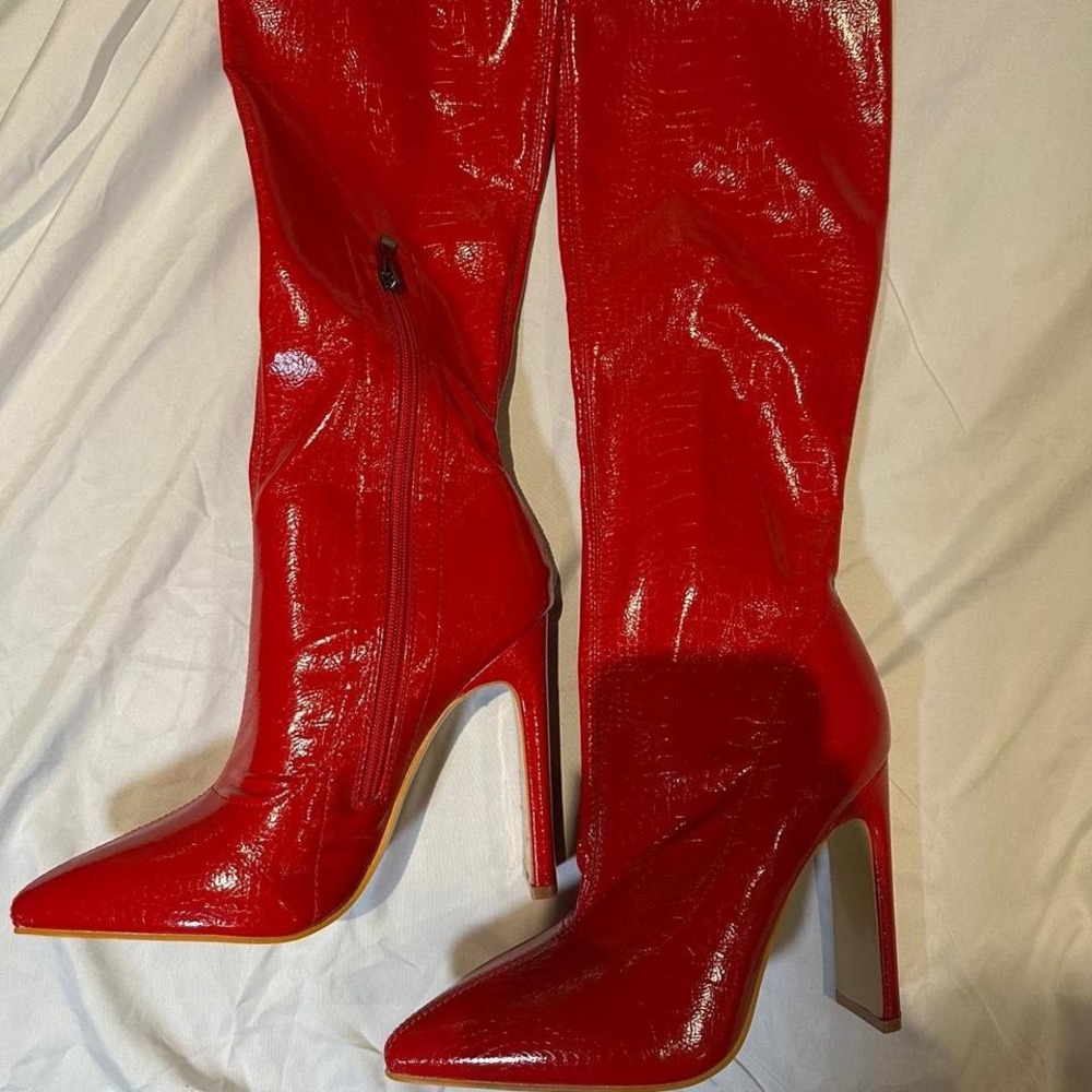 Red knee high faux leather boots
